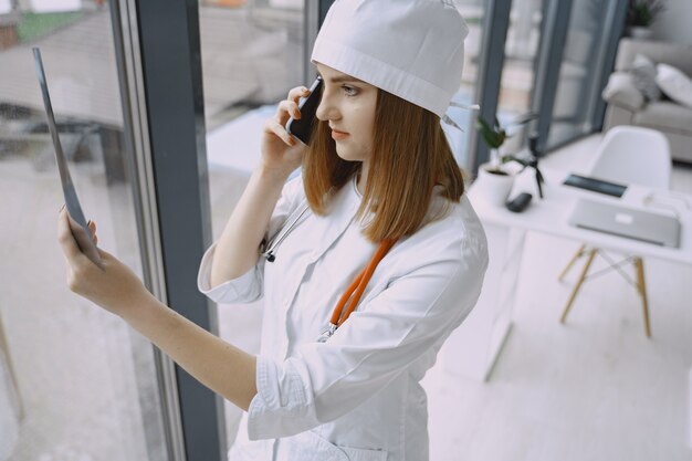 Woman doctor with white coat in hospital