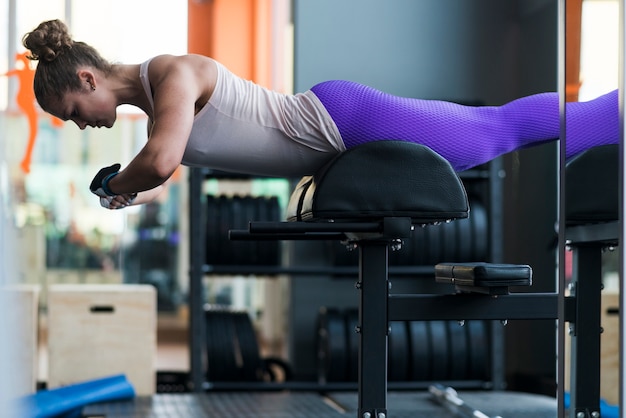 Free photo woman doing back exercises