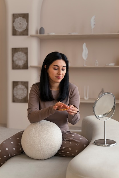 Free photo woman doing ethnic beauty routine