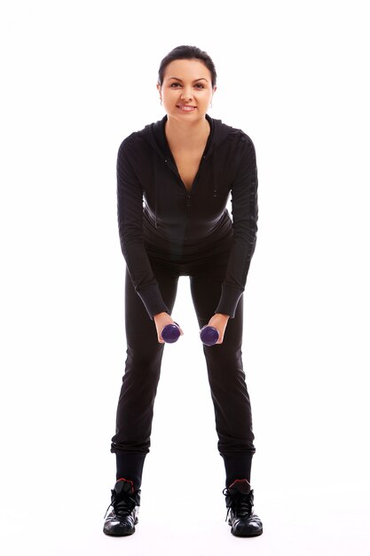 Woman doing fitness exercises with weights