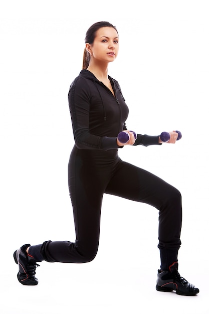 Woman doing fitness exercises with weights