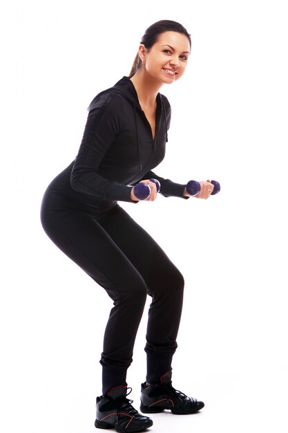 Woman doing fitness exercises with weights