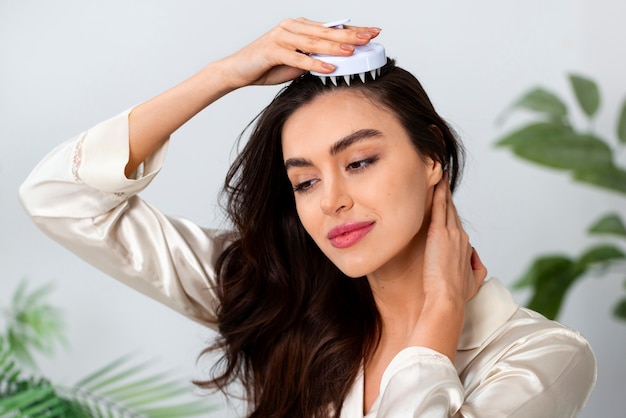 Woman doing herself a scalp massage