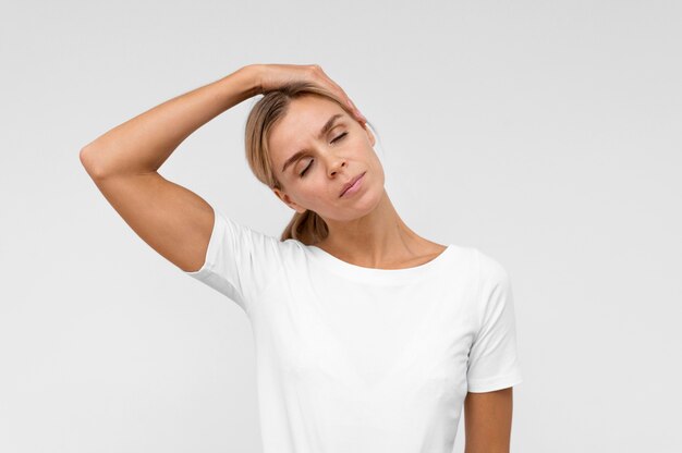 Woman doing physiotherapy exercises for neck