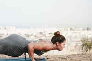 Free photo woman doing push up exercise