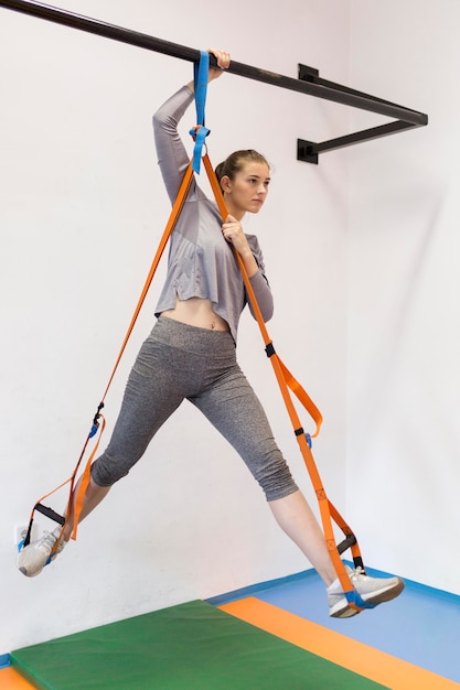 Free photo woman doing streching exercises