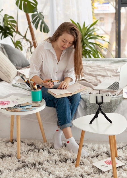 Woman doing a tutorial with her phone