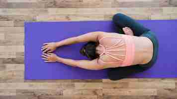 Free photo woman doing yoga exercise