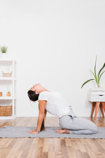 Free photo woman doing yoga exercise