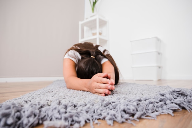 Free photo woman doing yoga at home