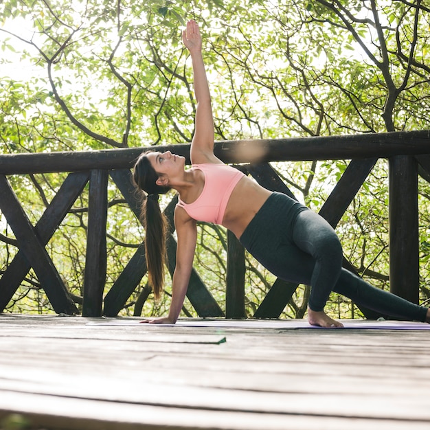 Woman doing yoga outdoors