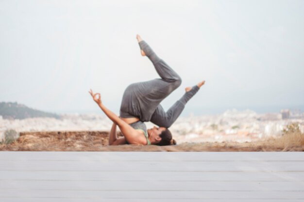 Woman doing yoga training outdoors