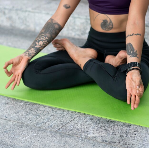 Woman doing yoga while in lotus position