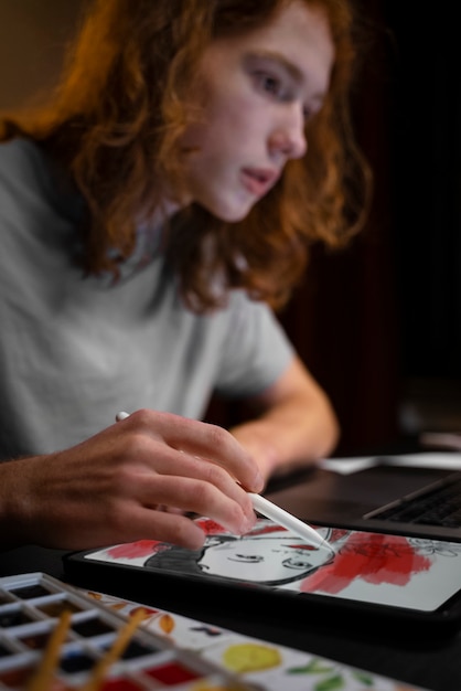 woman drawing on ipad side view