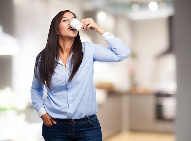 Woman drinking from a cup