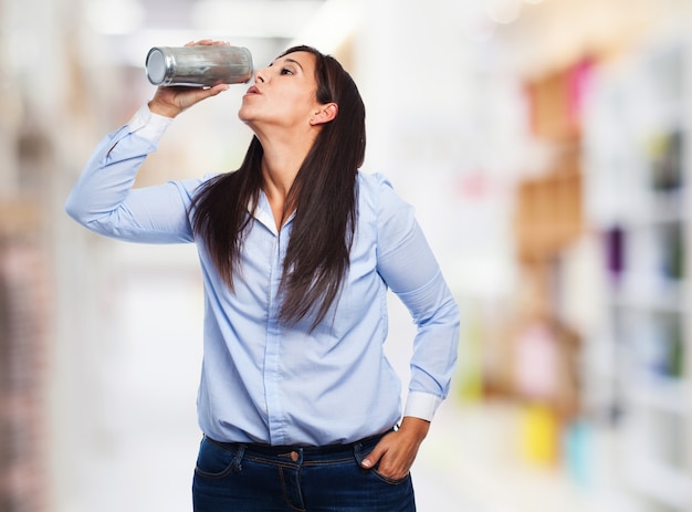 Woman drinking from a water bottle