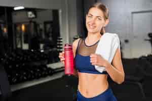 Free photo woman drinking in gym