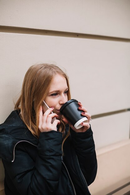 Free photo woman drinking and talking