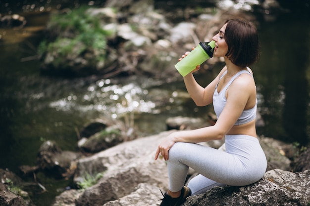 Woman drinking water in sportswear