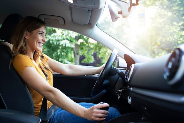 Woman driving automobile