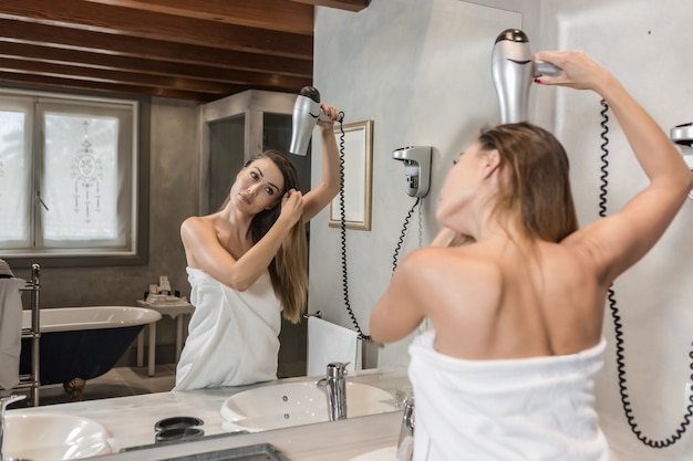 Elegant Woman Standing Under The Shower Free Photo