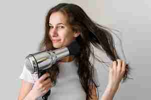 Free photo woman drying hair