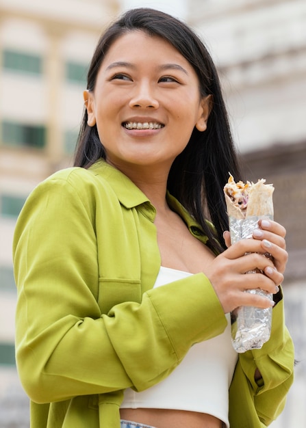 Woman eating street food