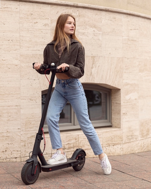 Woman on electric scooter outdoors