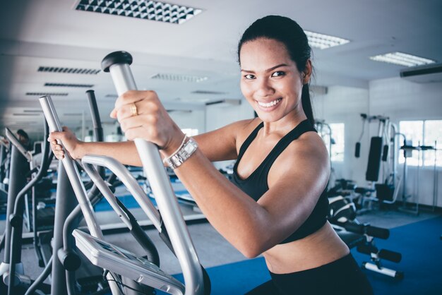 Woman in an elliptical machine