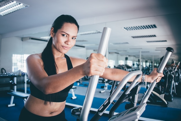 Woman in an elliptical machine