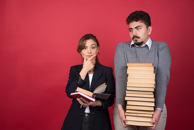 Woman employee looking at camera with her partner next to her