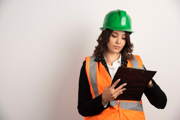 Woman engineer looking at important documents