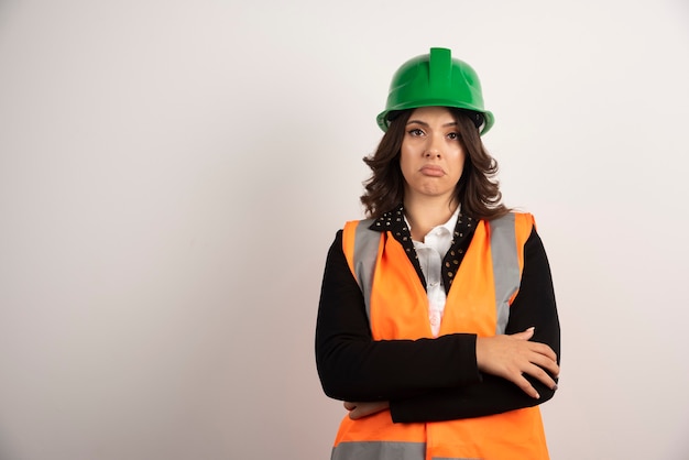 Woman engineer standing on white
