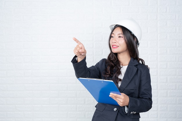 Woman of Engineering holding documents