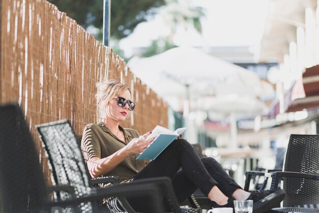 woman enjoying book on vacation