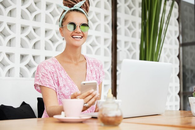 Woman enjoying dessert and drink in cafe