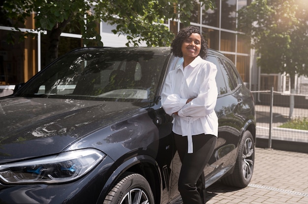 Woman enjoying her financially independence while buying car