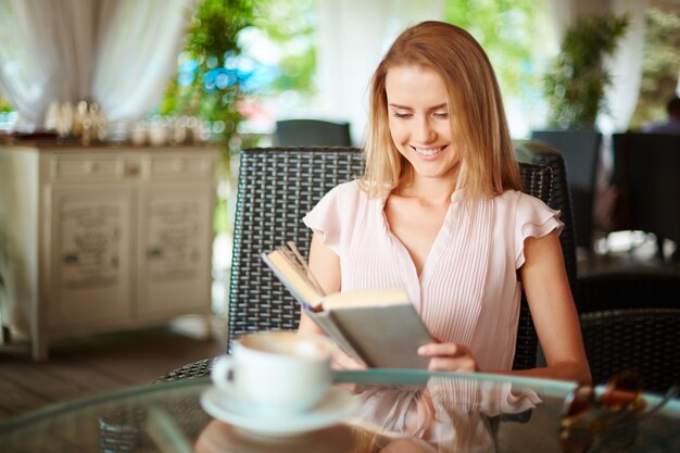 Woman enjoying her free time with a book