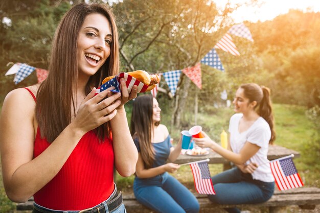 Woman enjoying hot-dog 