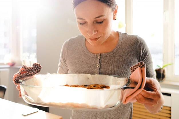 Woman enjoying the smell of freshly baked pie