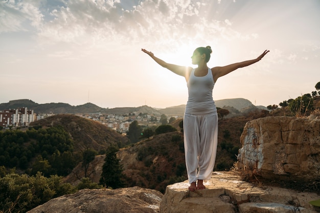 Woman enjoying yoga and fresh air