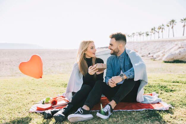 Woman excited with present from man