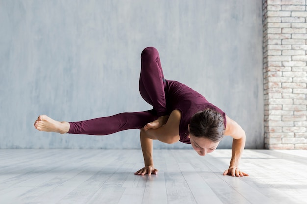 Woman executing a core yoga pose