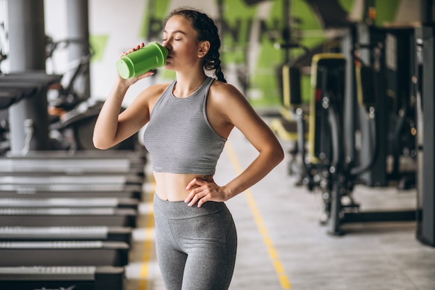 Woman exercising at the gym by herself