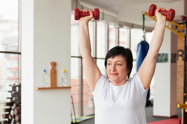 Woman exercising with weights