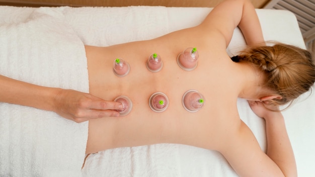 Woman experiencing cupping therapy
