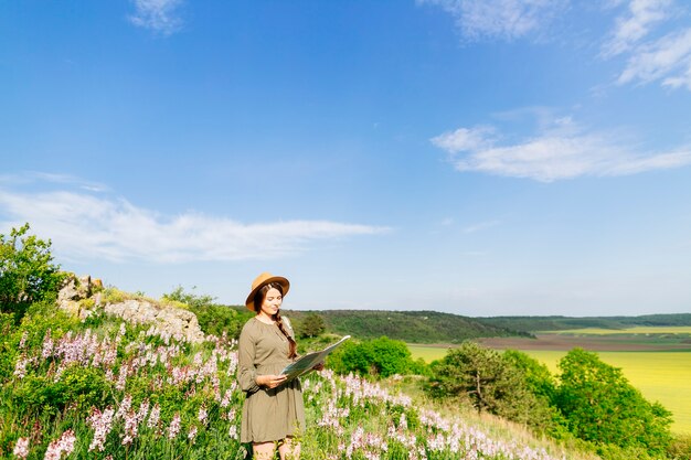 Woman on field with map