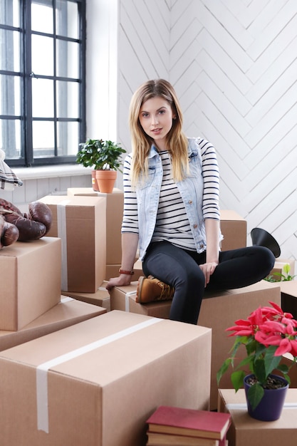 Woman finished with cargo packages and is ready to shipping or moving