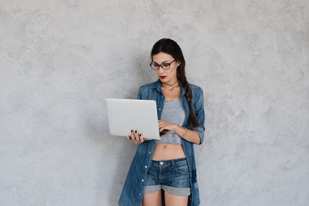 woman focused on laptop screen