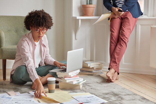 Woman freelancer uses application on laptop computer